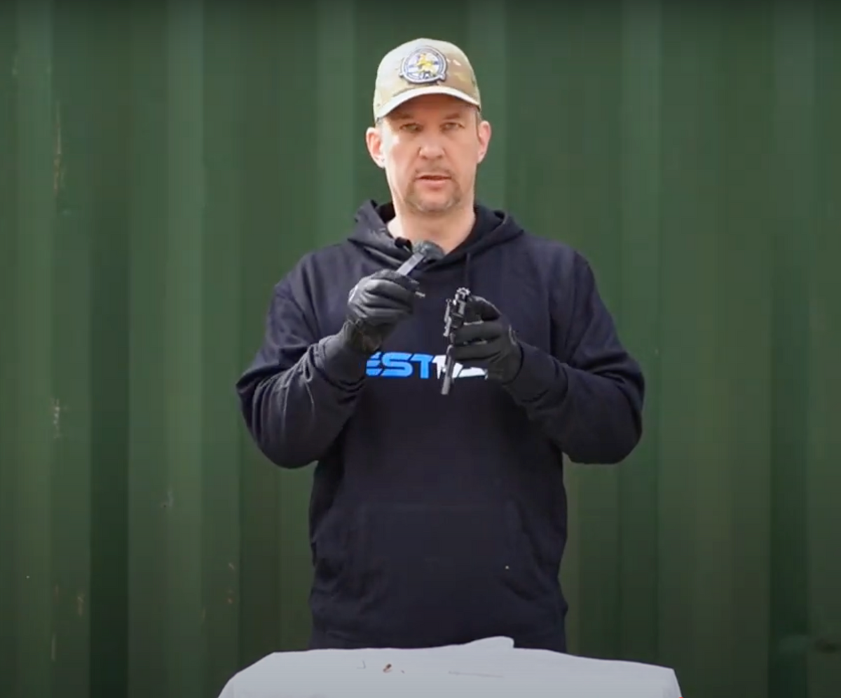 Instructor demonstrating an AR-15 bolt carrier group