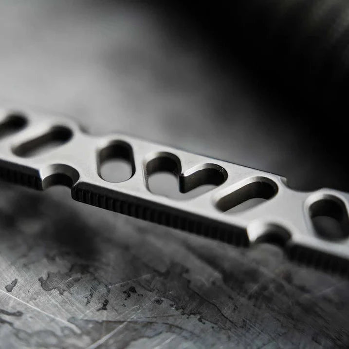 A close-up of a Boeker Sigurd 42 with cut-out design on a textured surface