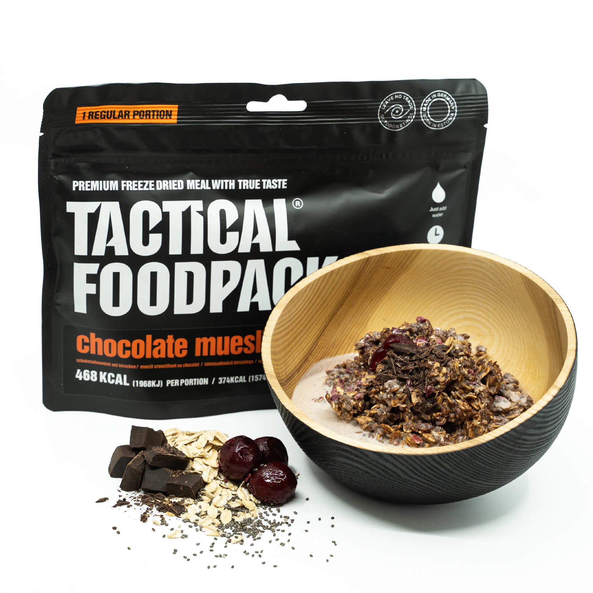 Tactical Foodpack chocolate muesli package with a wooden bowl of muesli on a white background