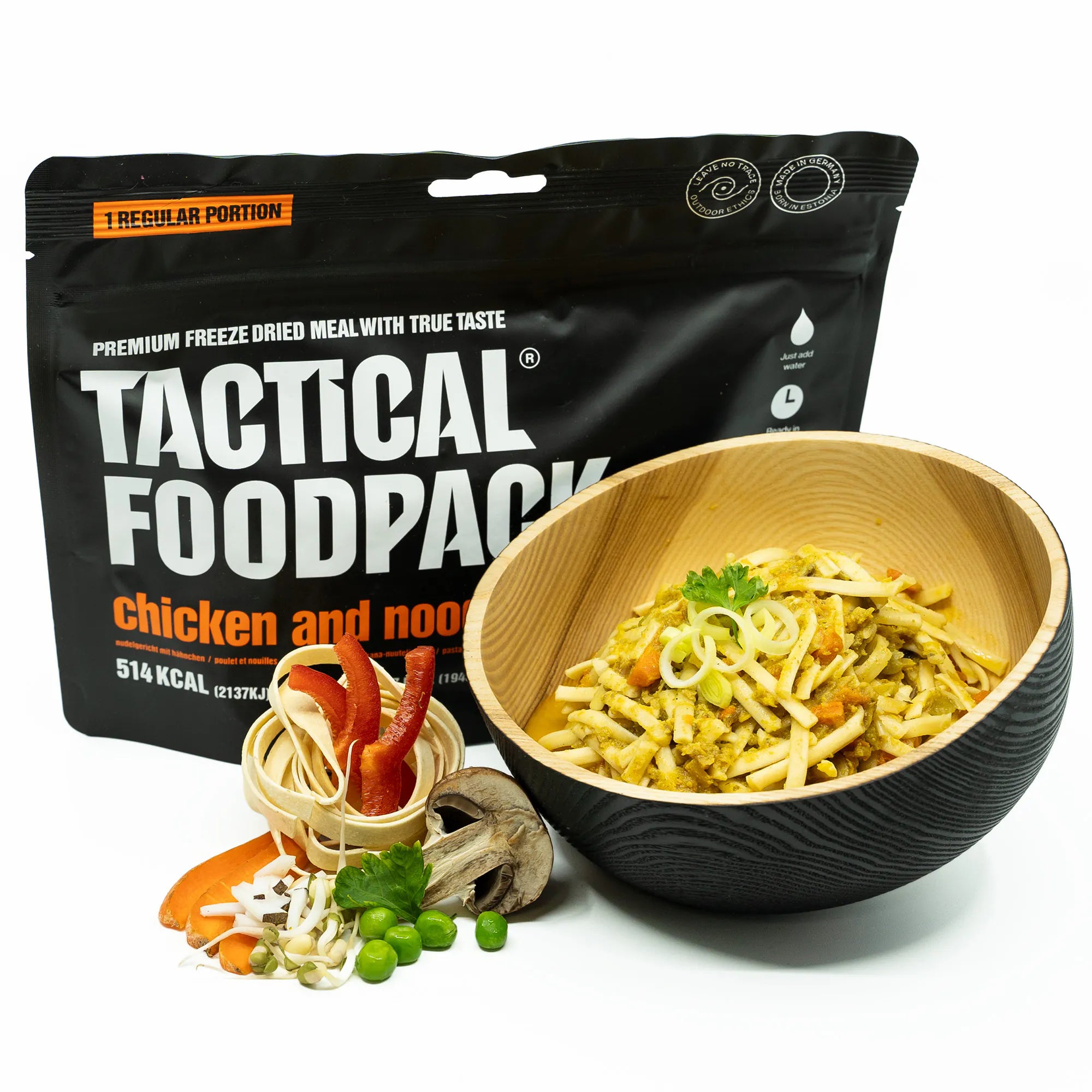 Tactical Foodpack chicken and noodle meal with a bowl of pasta on a white background