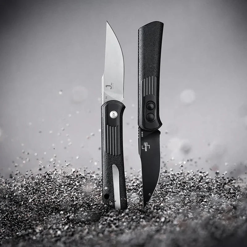 Two Böker Alluvial All Black on a textured surface