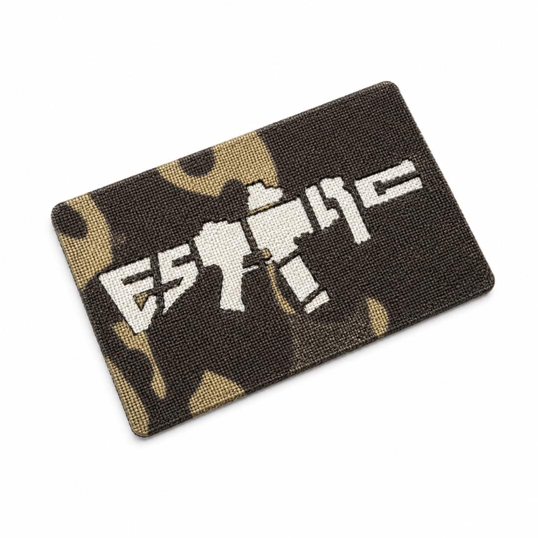 Black Multicam patch with 'ESTTAC' text and rifle