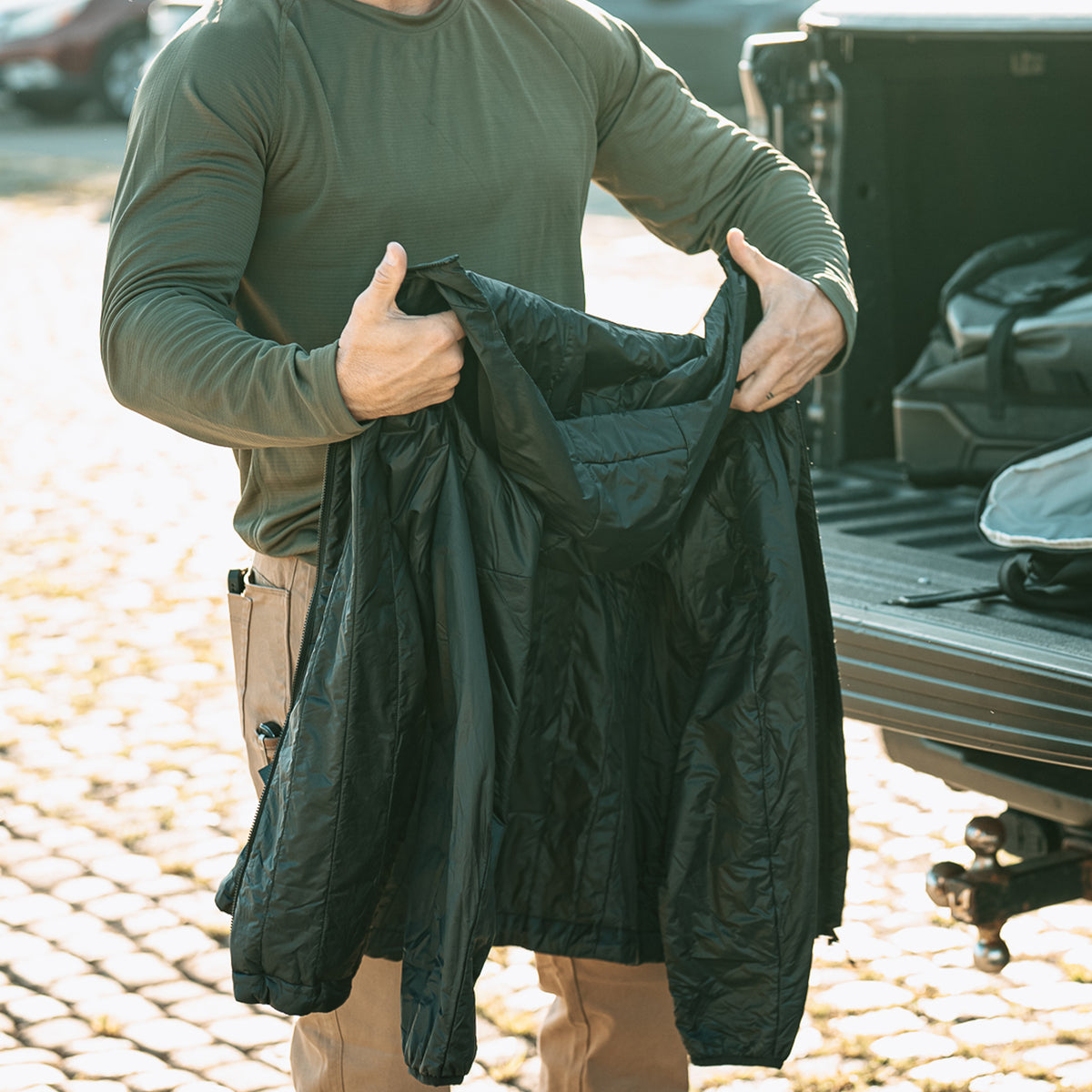 Inside view of Black Vertx InBound UltraLight Puffer Jacket showing interior pockets