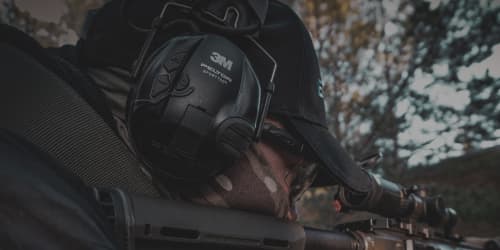 man shooting while wearing hearing protecion 