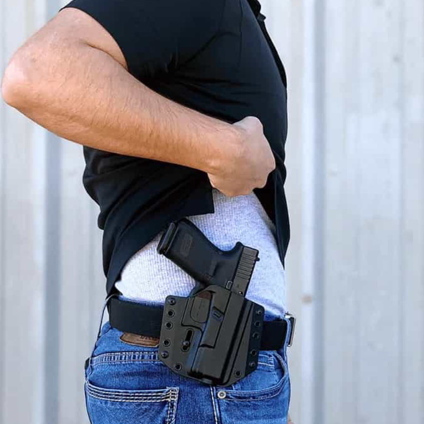 Bravo Concealment OWB Holster For Glock 43, 43X, 43X MOS with glock handgun on male model