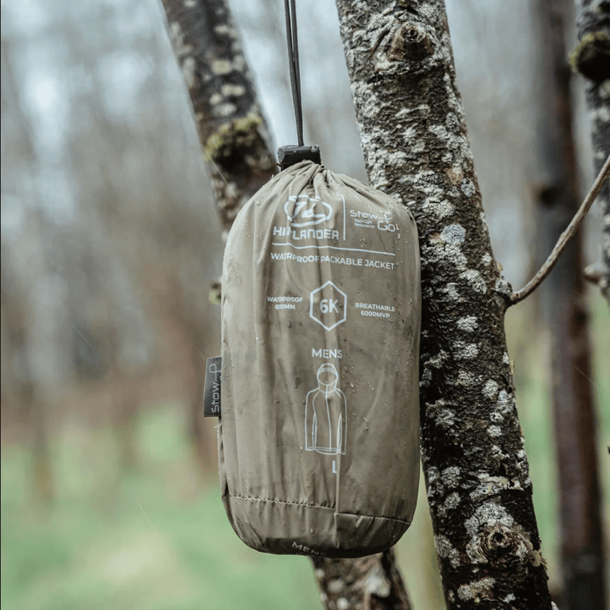 Highlander Forces Stow & Go Pack Away Waterproof Jacket in the woods
