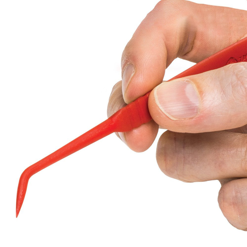 Real Avid Accu-Grip Cleaning Picks & Brushes in hand