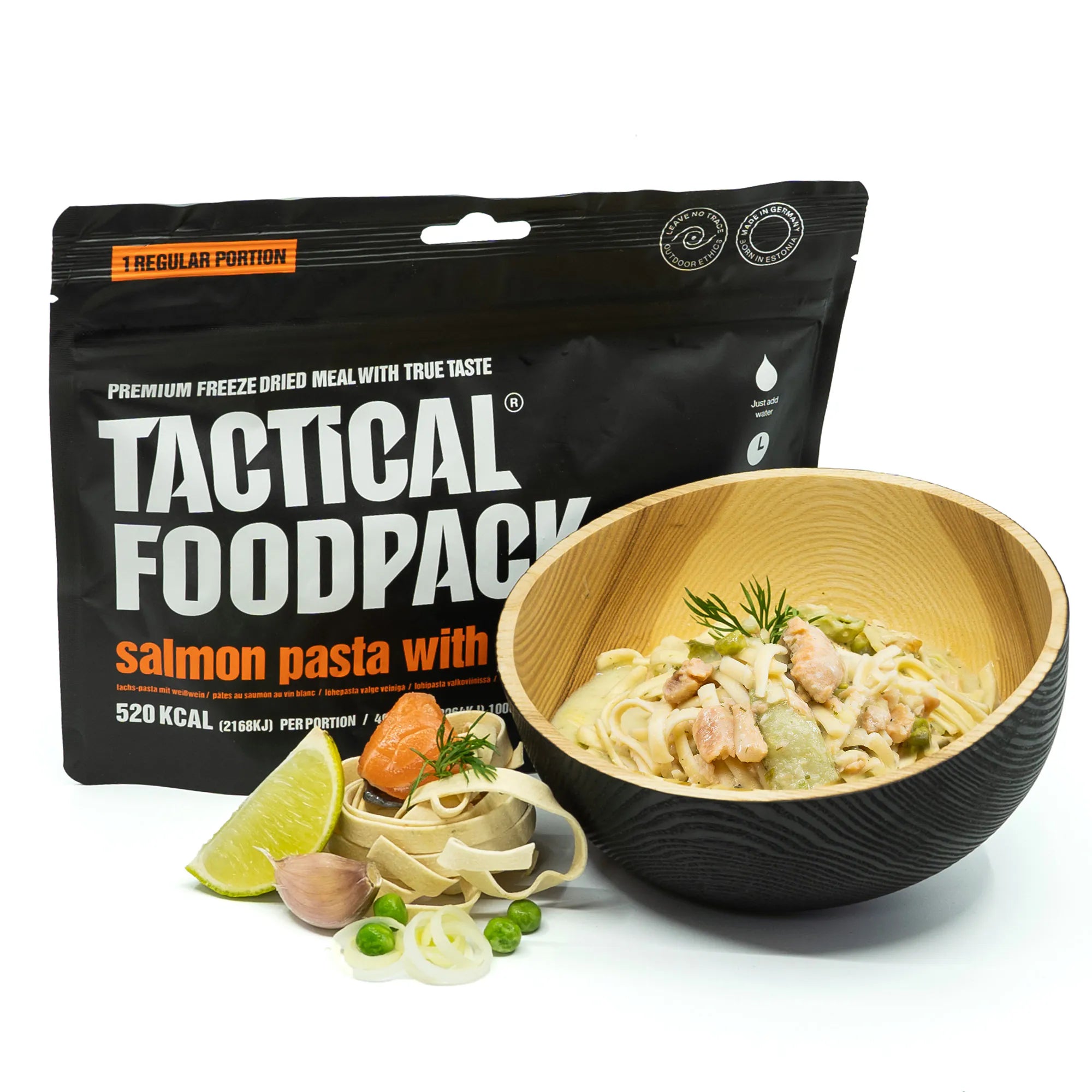 Tactical Foodpack salmon pasta meal with packaging and bowl on a white background