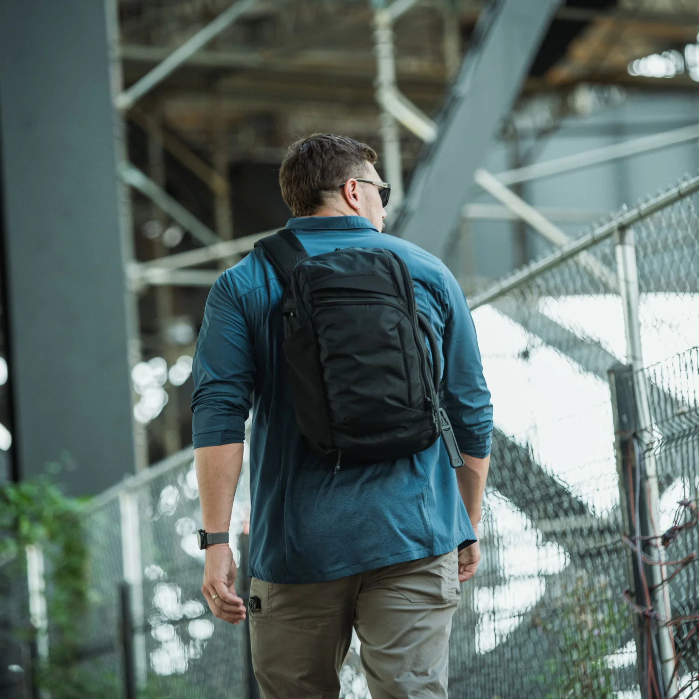 Vertx Gamut 18L Sling Bag walking in the city