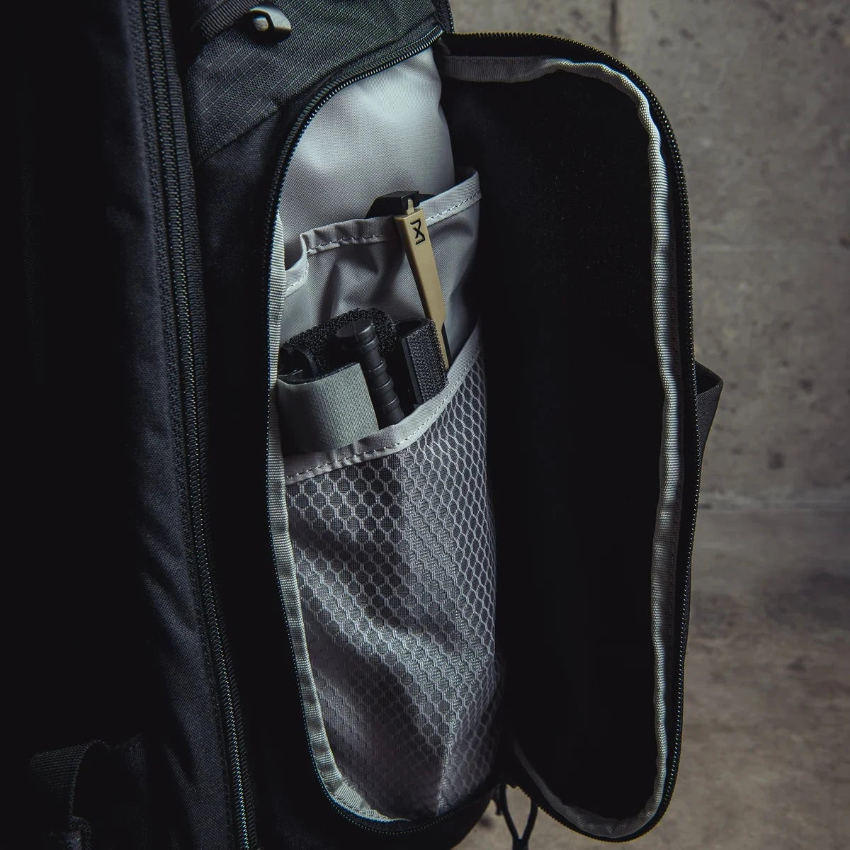 Vertx Gamut 32L Backpack side pocket