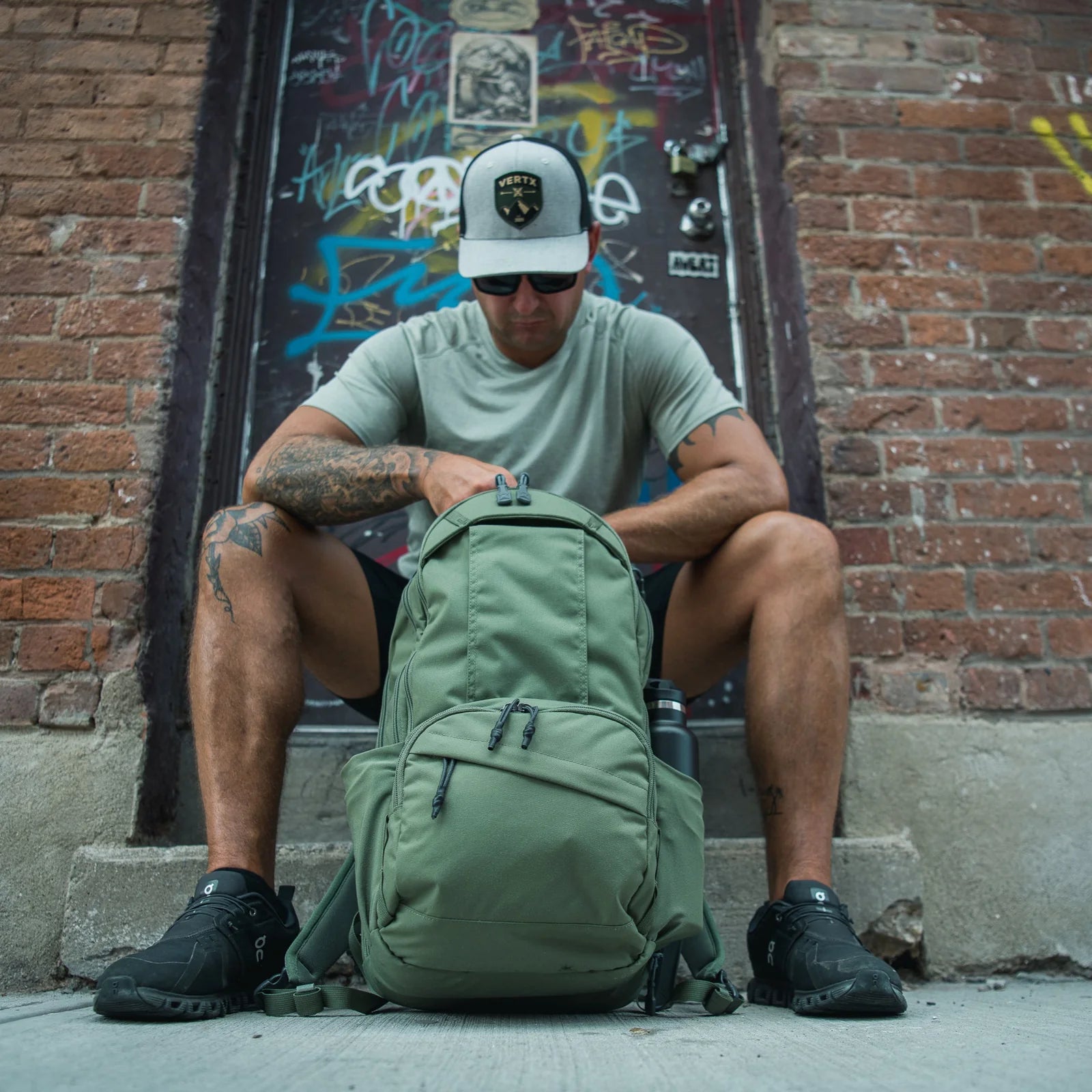 Vertx Ready Pack X Backpack man siting