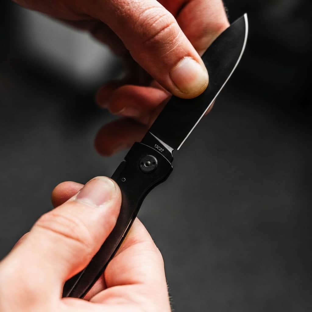 Close up holding Böker Plus Atlas All Black pocket foldable knive EDC