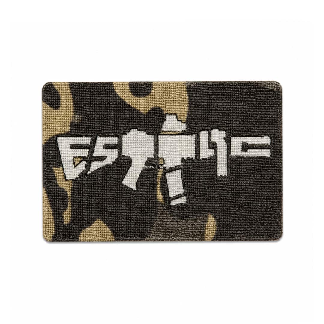 Black Multicam patch with an ESTTAC logo on a white background