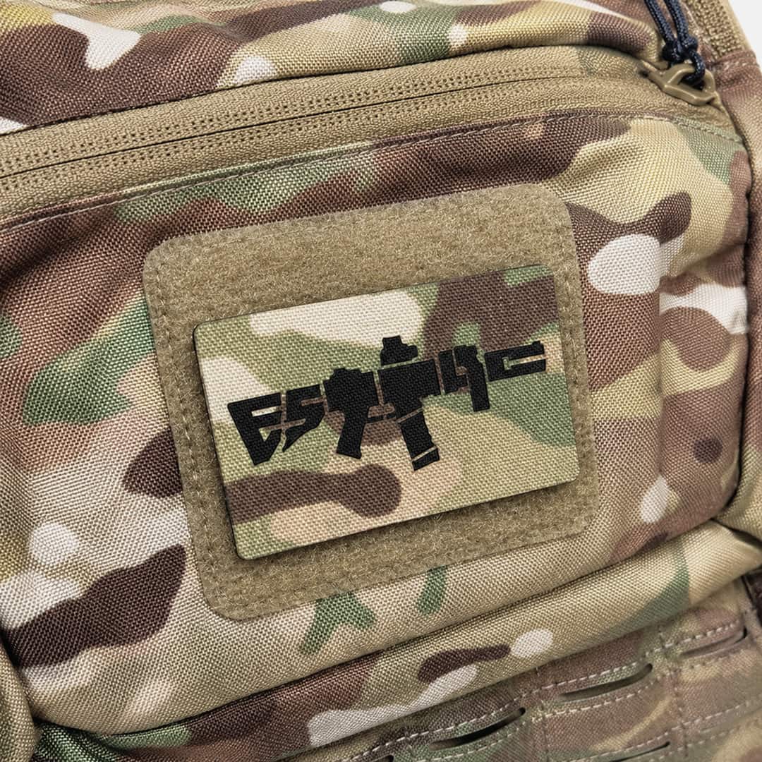 Multicam bag with a ESTTAC patch featuring an rifle design