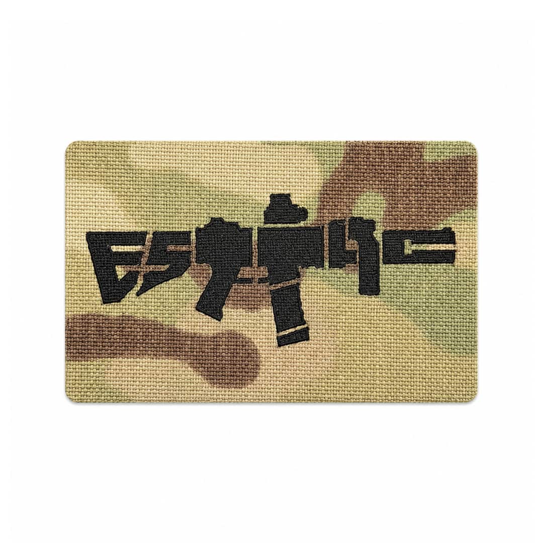 Multicam ESTTAC patch with black graphic design on a white background